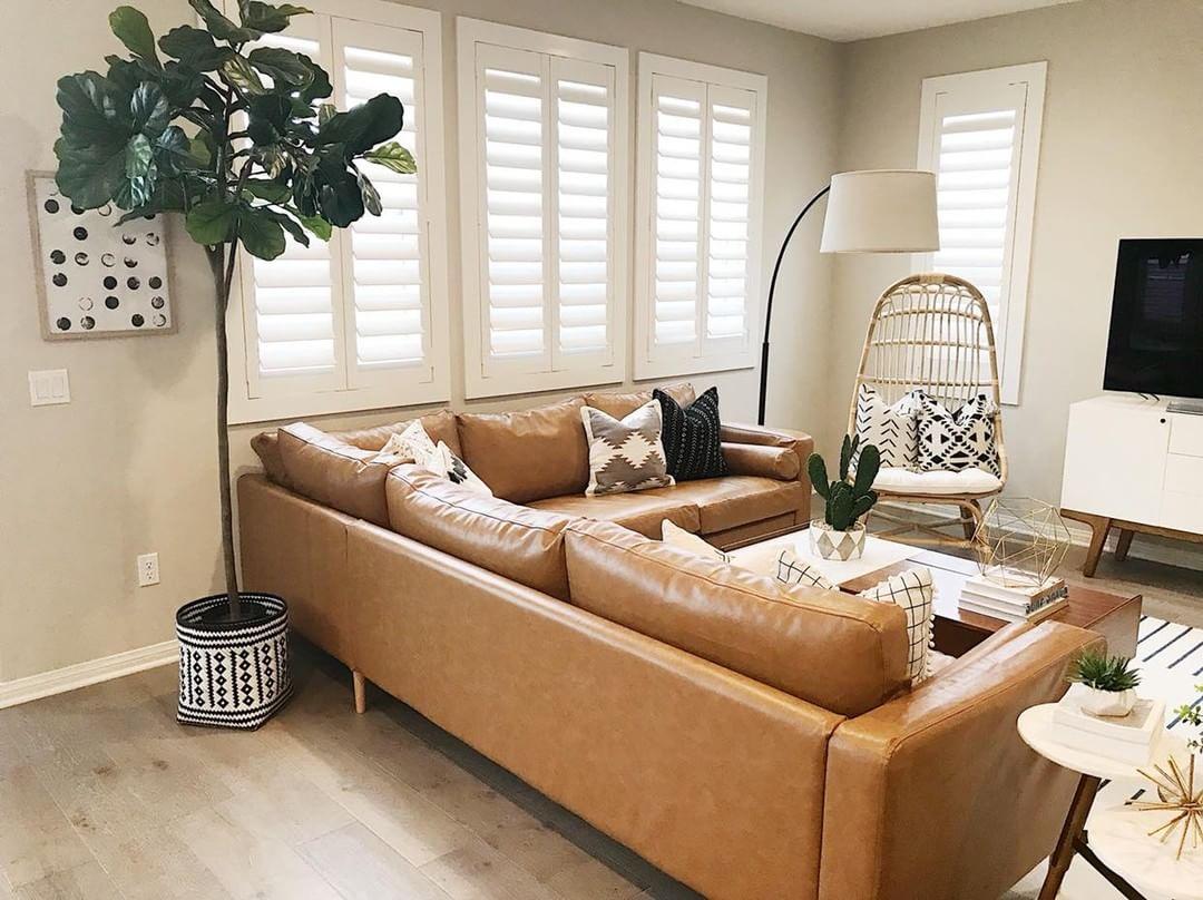 Comfortable living room with our Polywood shutters in Boston.